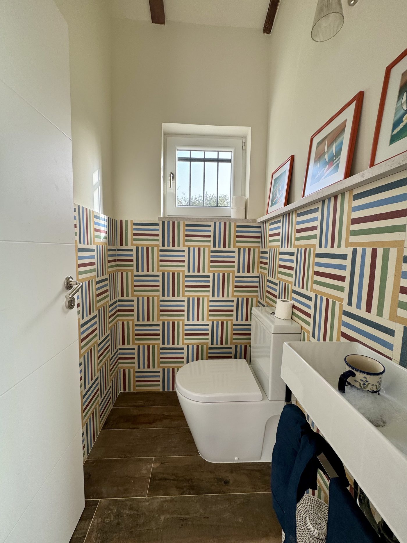The ground-floor guest cloakroom with hand-patterned tiles