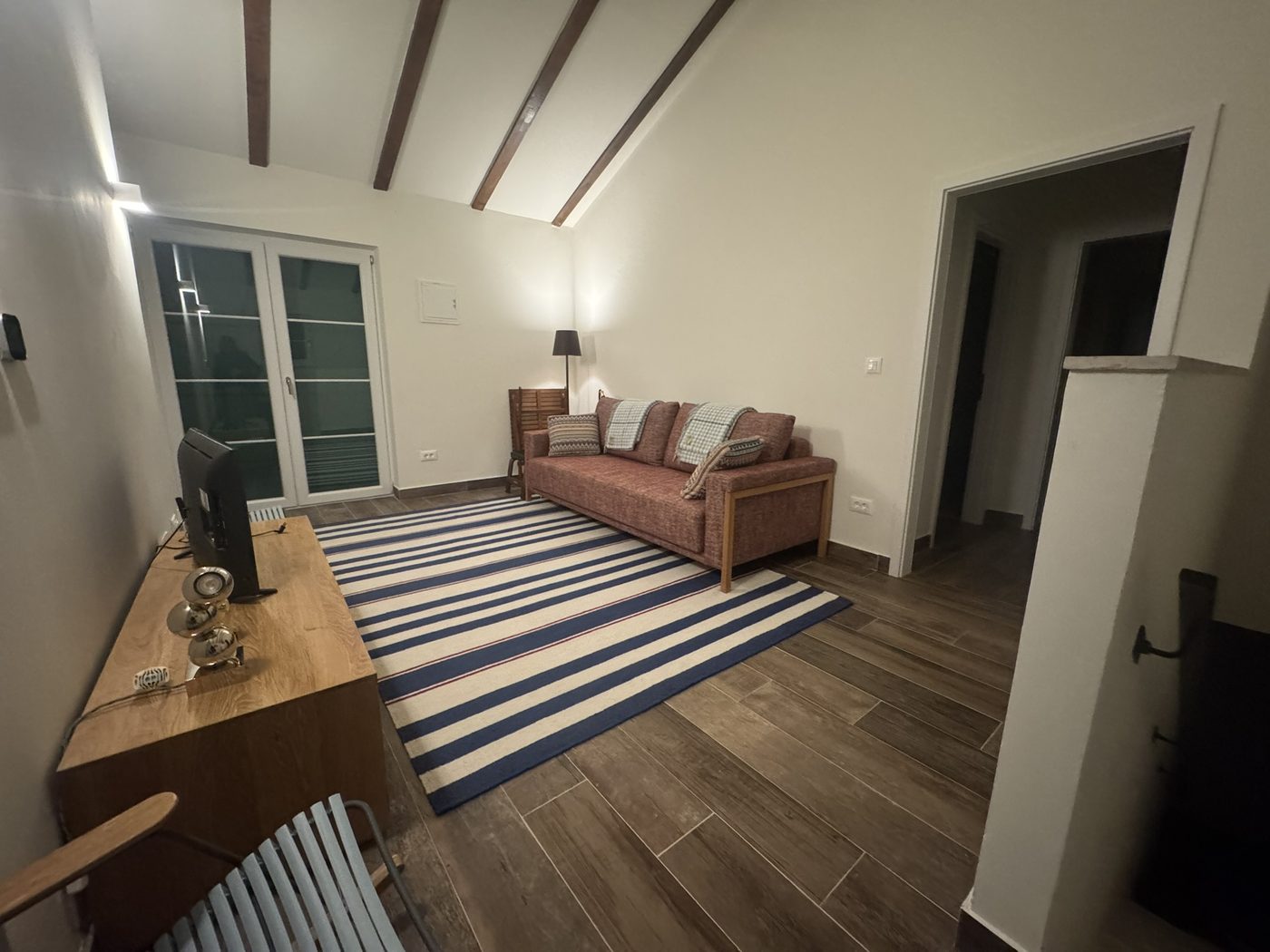 The middle room on the first floor, with sofa bed and terrace doors